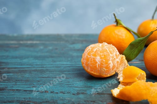 Preview: Fresh ripe tangerines on table. Space for text