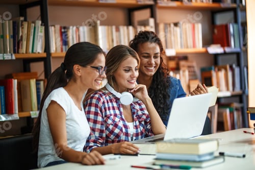 Preview: Group of female students study in the college library.