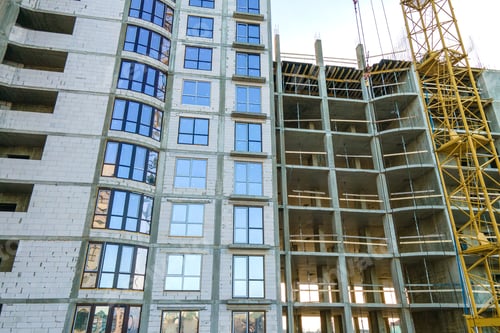 Preview: Aerial view of high residential apartment building under construction. Real estate development