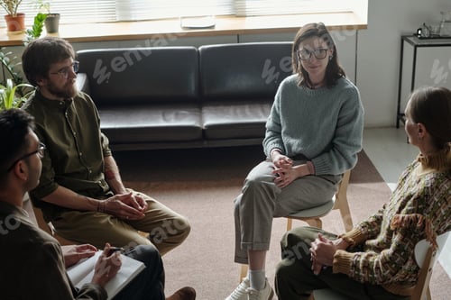 Preview: Group of Young and People Engaging in Supportive Therapy Discussion
