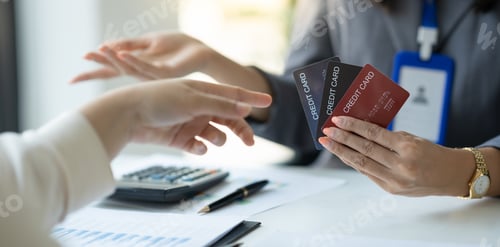 Preview: Young businesswoman, company employee presenting a form of credit limit, benefits, how to use the ca