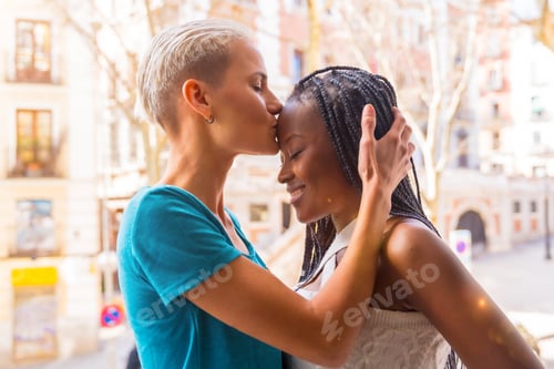 Preview: Beautiful lesbian couple kissing on the balcony at home, lgbt concept