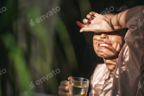 Preview: woman drinking lemon tea