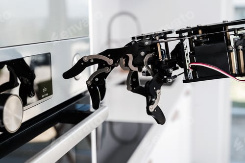 Preview: Real robot's hand and electric oven. Concept of robotic process automation