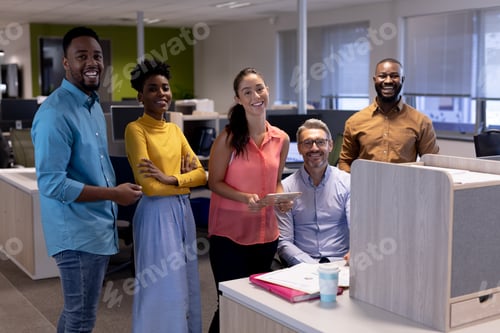 Preview: Portrait of happy multiracial business colleagues in meeting at modern workplace