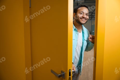Preview: Portrait of Hindu man inviting you to enter office