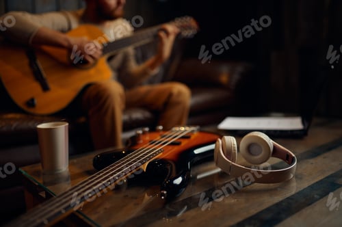 Preview: Male guitar player enjoy online training lesson