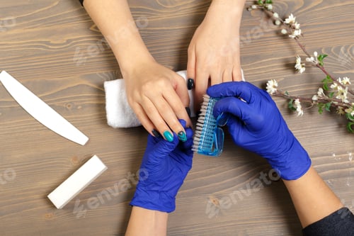 Preview: Hands Receiving a Manicure in a Home Setting
