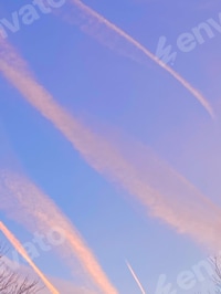 Preview: Cloud streaks in blue sky at sunset
