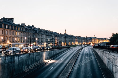 Preview: Traffic and lights in street at dusk. Bordeaux