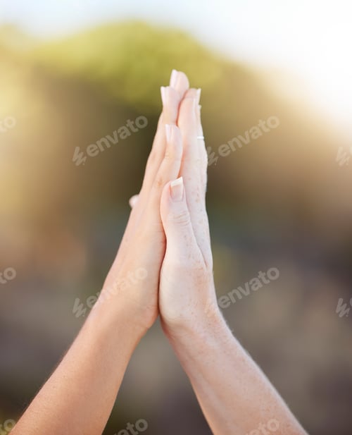 Preview: Women high five for support, teamwork and solidarity with bokeh outdoor sunshine or light. Motivati
