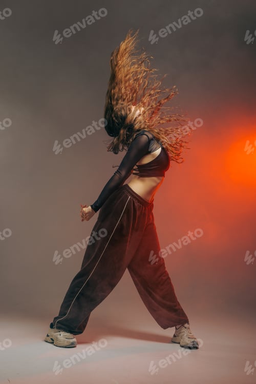 Preview: Jazz Funk Dancer Performing Dynamic Hair Flip in Urban Studio with Dramatic Lighting and Smoke