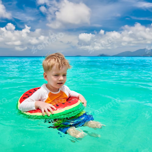 Preview: Three Year Old Toddler Boy On Beach At Seychelles Swimming With Inflatable Ring