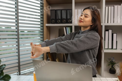 Preview: woman stretching and working at home, beautiful woman relax at desk