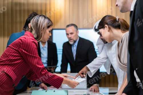 Preview: Group of multi-Ethnic businessman and businesswoman working in office.