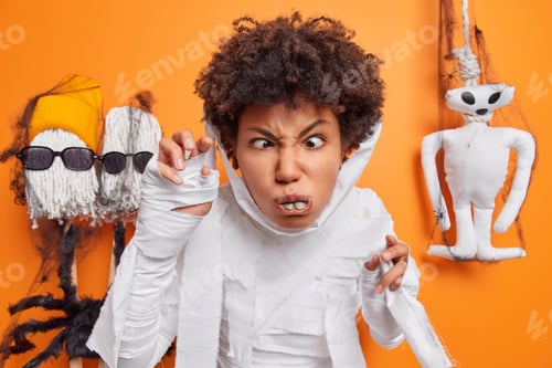 Preview: Grumpy angry Afro American woman tries to frighten people says boo attracts her attention dresses up