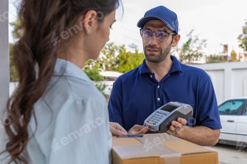 Preview: Delivery express courier young man use giving boxes or Food to woman customer at front home