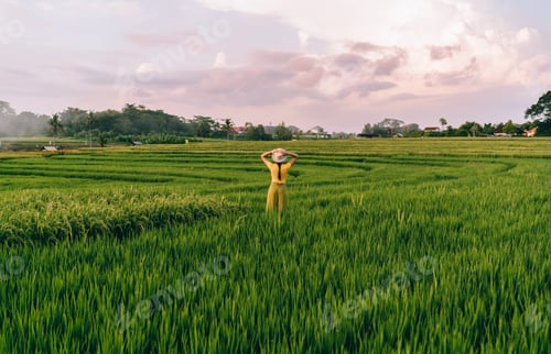 Preview: Unrecognizable female worker contemplating farm field
