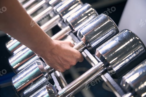 Preview: Professional sportsperson prepping for strength training session