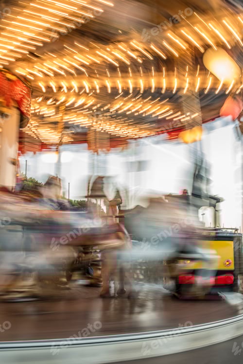 Preview: Carousel with horses in amusement park.