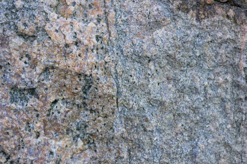 Preview: Granite Texture Close Up. Granite Rocks With Porous Surface. Background From Solid Stone. Pattern