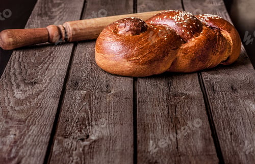 Preview: Fresh Home-Made Bread And A Rolling Pin On A Wooden Background.