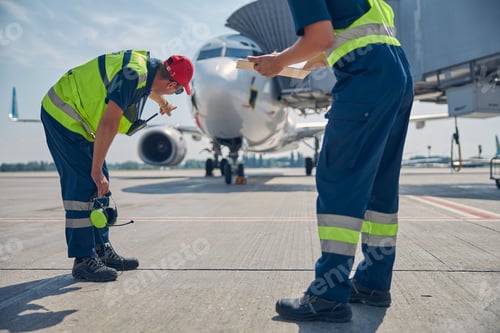 Preview: Aircraft maintenance technicians carrying out a post-flight inspection