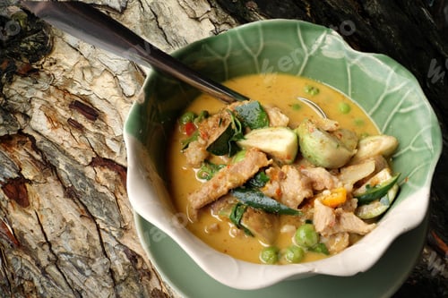 Preview: Thai Green Pork Curry On A Wood Background.
