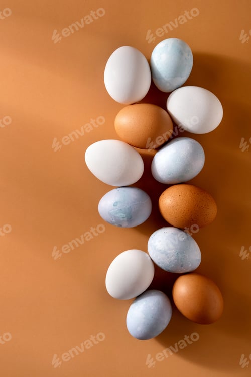 Preview: Naturally dyed easter eggs on beige background. Eco concept. Organic natural easter concept.