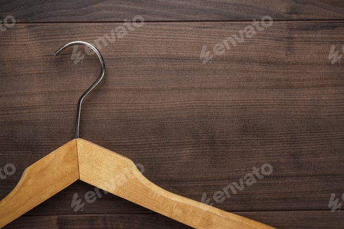 Preview: Wood Hanger Against Brown Wood Background