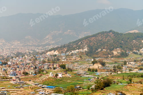 Preview: View of Kathmandu capital of Nepal from mountain through urban haze with lot of low rise buildings