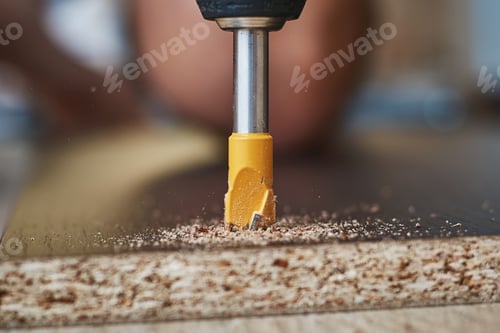 Preview: process of drillig wood with a drill bit close up