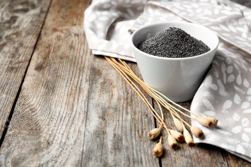 Preview: Composition with poppy seeds on wooden table