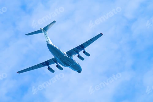 Preview: Airplane in blue sky. Air cargo transportation. Plane is flying