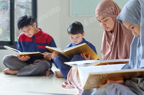 Preview: Group of muslim children reading Koran or Quran together