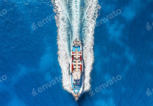 Preview: Aerial view of beautiful floating yacht in blue sea on sunny day in summer