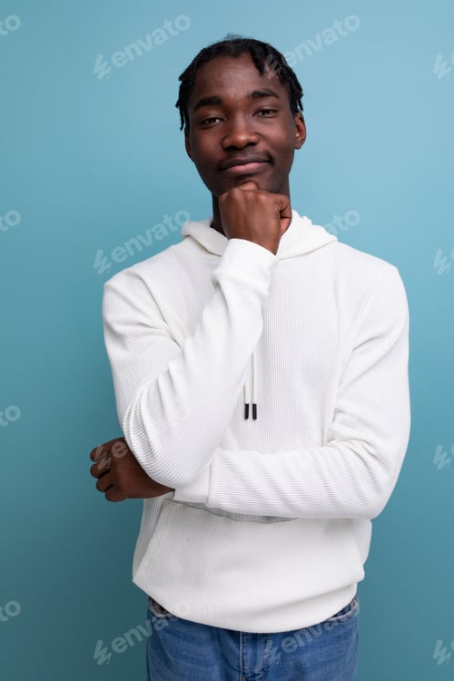 Preview: positive young african guy in white sweatshirt