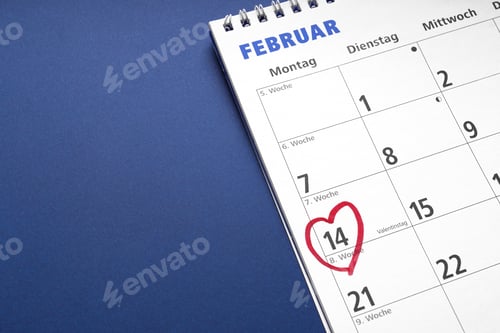 Preview: red heart drawn around february 14th as Valentinstag or Valentine's day symbol on german calendar