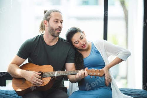 Preview: pregnant woman with her husband couple at home, family person pregnancy motherhood concept