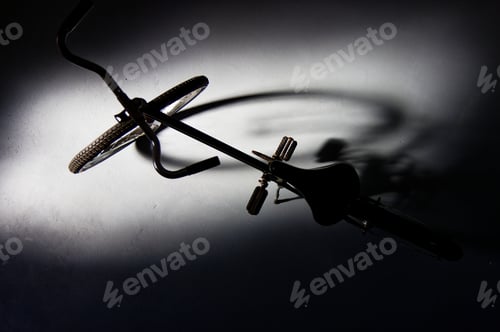 Preview: High angle shot of a vintage bicycle parked in a dark garage