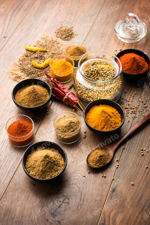 Variety of Spices and Herbs on Wood Table
