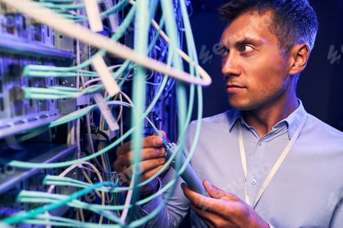 Preview: Sysadmin doing performance testing of network cabling