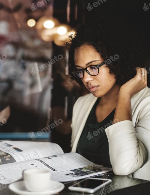 Preview: Businesswoman reading the daily news