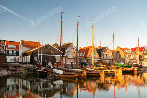 Preview: Urk Flevoland Netherlands sunset at the lighthouse and harbor of Urk Holland