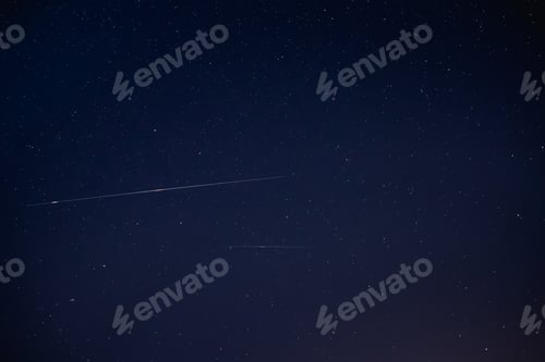 Preview: Two Meteoric Tracks In The Blue Night Starry Sky Background. Nat