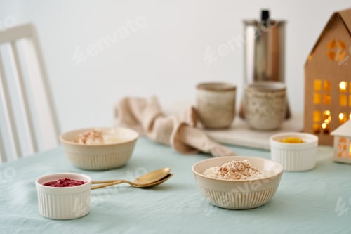 Preview: Cozy Christmas holiday morning or evening atmosphere with tradition Christmas food. Rice pudding