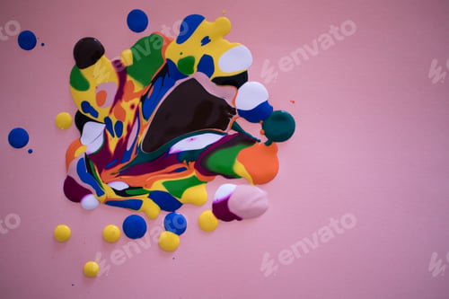 Preview: Abstract colorful paint mix against pink background