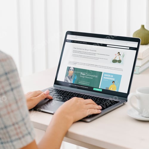 Preview: Woman checking out free design resources at a website