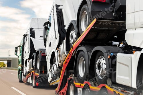 Preview: Back view of semi-trailer flatbed vehicle deliverying many new electric trucks sale automotive