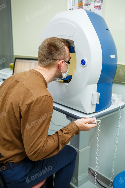 Preview: Professional medical equipment scanning the patient's eyes. The device of a modern healthcare clinic